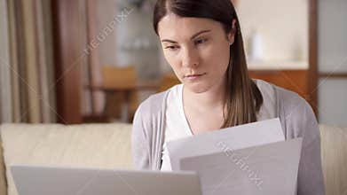 Stressed businesswoman crumpling piece of paper. Frustrated professional female throwing documents