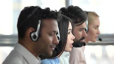 Young asian girl working in tech support.