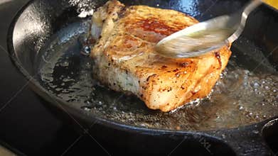 Raw pork chop in a frying pan