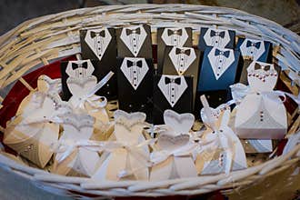 Wedding favors for the guests in a wicker basket.