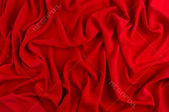 Red silk wavy background. Passion backdrop for Valentines day.