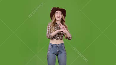 Cowboy girl dances energetic dances and sings. Green screen