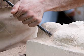 Close up of a sculptor at work