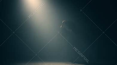 Woman in kimono practicing martial arts with katana