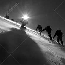 Climbers climbing the glacier