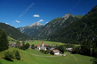Overlook of the township of Holzgau amid the foothills of the Austrian Alps.