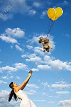 Smiling girl and her flying poodle dog