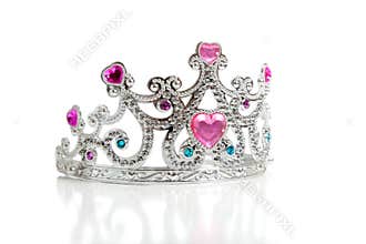 A child's toy princess tiara on a white