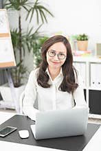 Asian woman using laptop at home,