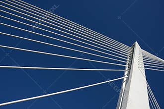 Top bridge pillar joining ropes, blue sky. Success.