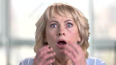 Face of shocked terrified woman.