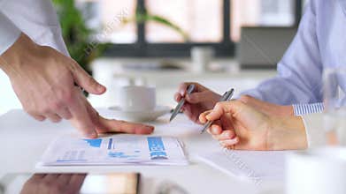 Business team discussing charts at office