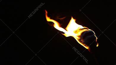 Torch burns at night