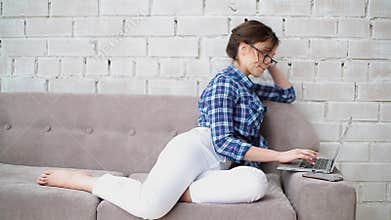 Woman work from home using her laptop to check work email