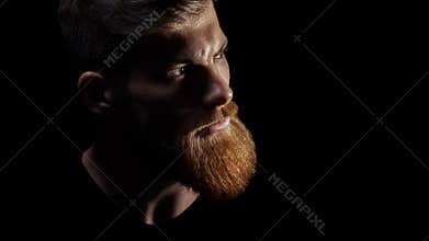 Close up image of serious brutal bearded man