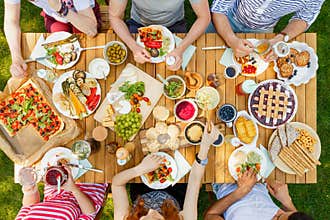 Friends eating healthy food outdoors