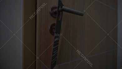 Man hanging Please Make Up Room sign on hotel room door handle, close up