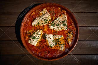 Seabass fish recipe oven with tomatoes and potato