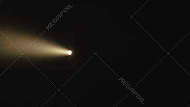 View of flashlight`s shadow in darkness of the ancient stone cave