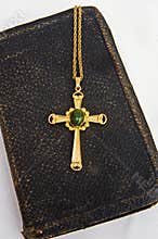 Old Bible with gold cross for Easter.