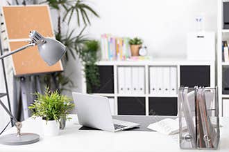 Workplace with notebook laptop Comfortable work table in office