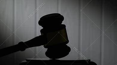 Silhouettes of a legal hammer.