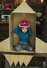 Dream about career of cosmonaut. Travel and adventure. Earth day concept. Education and kid idea development. Small boy