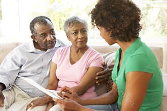 Senior Couple Talking To Financial Advisor
