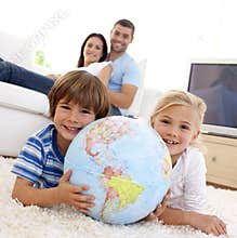 Children playing with a terrestrial globe