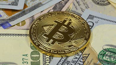 Gold Bitcoin Coin, BTC and Bills of Dollars are Rotating