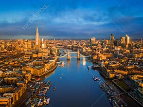 London, England - Aerial skyline view of London including iconic Tower Bridge with red double-decker bus