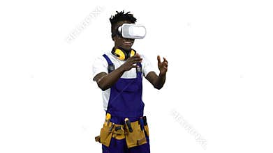 Engineer african american with virtual reality glasses looks at the building . Alpha channel