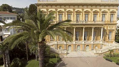 Facade of Fine Arts Museum building in Nice surrounded by greenery, architecture
