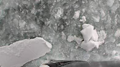 Ice chopping movement icebreaker view from bow of ship in ocean of Antarctica.