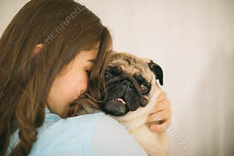 Adorable small dog. Human love and trust