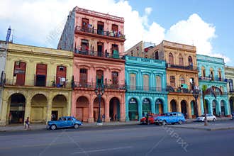 Colorful colonial buildings with old vintage cars, Havana, Cuba