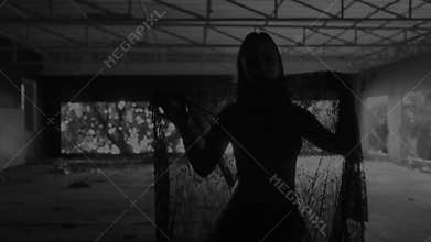 Beautiful woman dancing with lace fabric