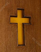Carved wooden cross on a church door