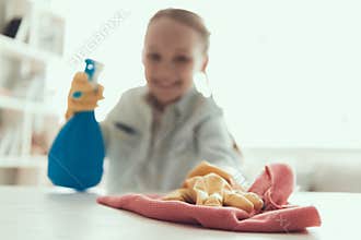 Closeup Little Girl helping Mother to Clean House