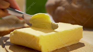Scraping butter with a knife