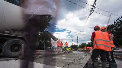 Concrete works for road maintenance construction with many workers and mixer timelapse hyperlapse