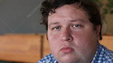 Young man face, a high detailed portrait, looking at camera