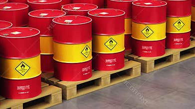 Group of rows of red stacked oil drums in storage warehouse