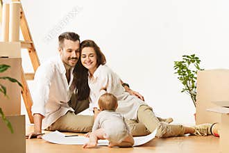 Couple moving to a new home - Happy married people buy a new apartment to start new life together