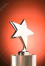Star award against red background