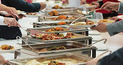 People group catering buffet food indoor in luxury restaurant with meat colorful fruits and vegetables. Close up