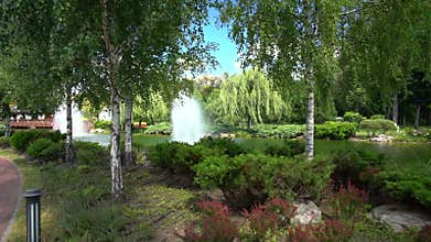 Picturesque urban park and lake with greenery