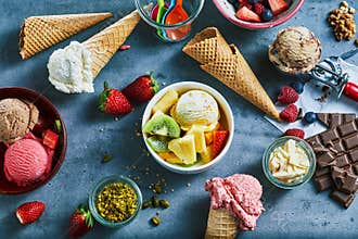 Flat lay of assorted ice cream with ingredients
