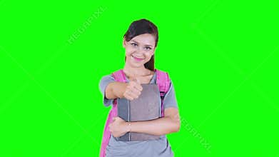 High school student showing thumb up in studio