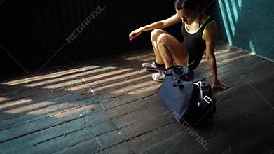 Slow motion fit young woman legs entering gym with bag and preparing for the training